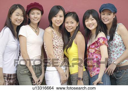 Portrait of a group of young women smiling View Large Photo Image Picture - Portrait of a group of young women smiling. Fotosearch