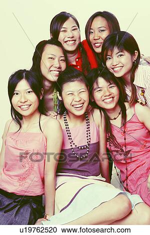 Stock Image - Portrait of a group of young women looking posing. Fotosearch