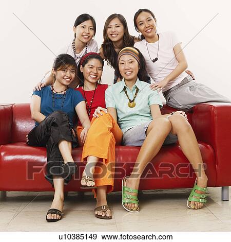Stock Photo - Portrait of a group of young women smiling. Fotosearch