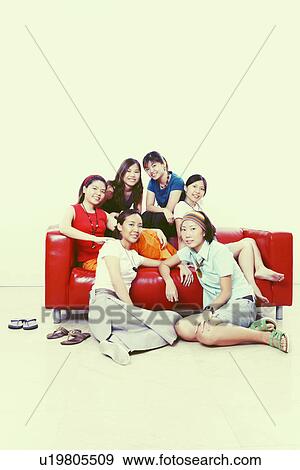 Stock Photo - Portrait of a group of young women smiling. Fotosearch