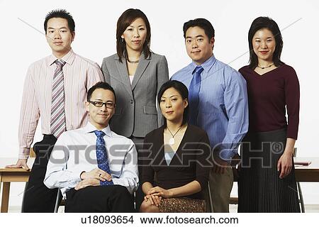 Picture - Portrait of three businesswomen and three businessmen smiling. Fotosearch