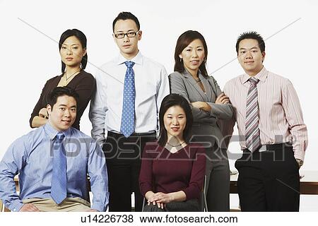 Stock Photo - Portrait of three businesswomen and three businessmen smiling. Fotosearch