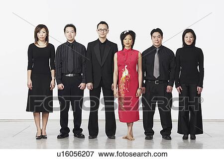 Stock Photo - Portrait of three young men and three young women looking serious. Fotosearch