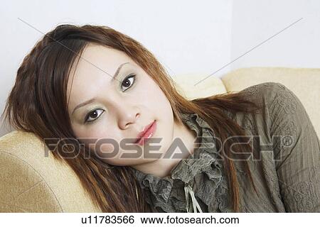 Stock Photograph - Close-up of a young woman. Fotosearch