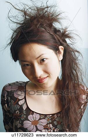 Stock Image - Portrait of a teenage girl smiling. Fotosearch