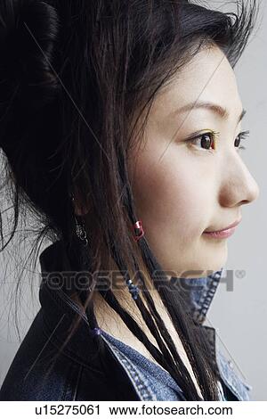 Side profile of a young woman View Large Photo Image Stock Image - Side profile of a young woman. Fotosearch