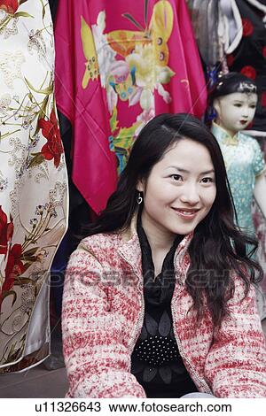 Stock Image - Close-up of a young woman smiling. Fotosearch
