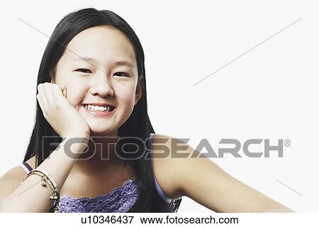 Portrait of a teenage girl smiling View Large Photo Image Stock Photo - Portrait of a teenage girl smiling. Fotosearch