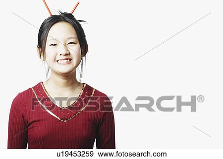 Stock Photo - Portrait of a teenage girl smiling. Fotosearch