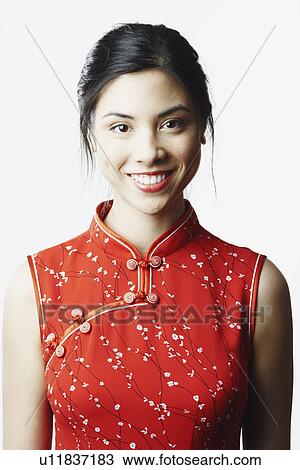 Stock Image - Portrait of a young woman smiling. Fotosearch