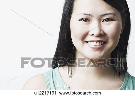 Stock Image - Portrait of a young woman smiling. Fotosearch
