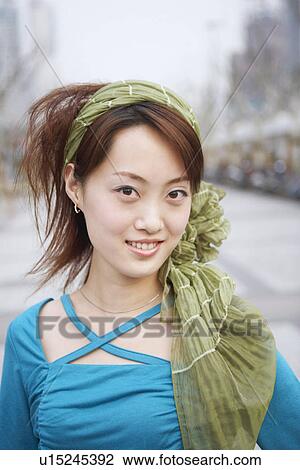 Portrait of a young woman smiling View Large Photo Image Stock Image - Portrait of a young woman smiling. Fotosearch