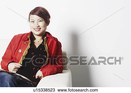 Portrait of a young woman smiling View Large Photo Image Stock Image - Portrait of a young woman smiling. Fotosearch
