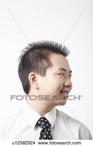 Close-up of a businessman smiling View Large Photo Image Picture - Close-up of a businessman smiling. Fotosearch