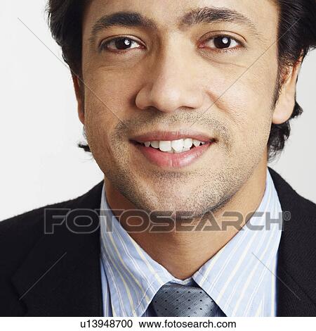 Stock Image - Portrait of a businessman smiling. Fotosearch