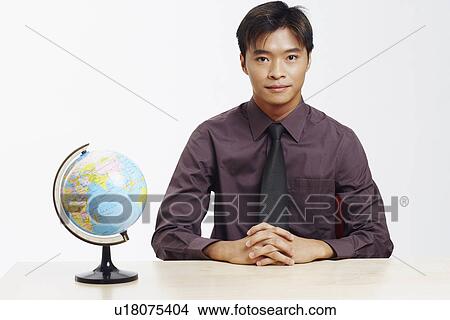 Portrait of a businessman thinking View Large Photo Image Picture - Portrait of a businessman thinking. Fotosearch