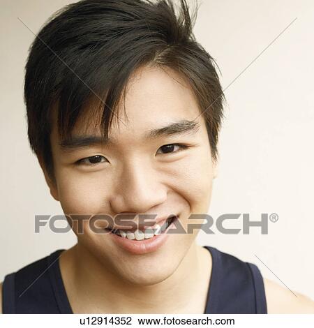Portrait of a young man smiling View Large Photo Image Stock Image - Portrait of a young man smiling. Fotosearch