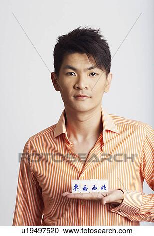 Portrait of a young man with blocks on his hand View Large Photo Image Stock Image - Portrait of a young man with blocks on his hand. Fotosearch