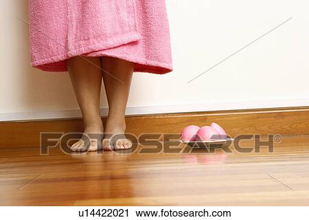 Low section view of a young woman standing with a plate of soap beside her View Large Photo Image Stock Image - Low section view of a young woman standing with a plate of soap beside her. Fotosearch