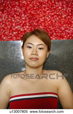 Portrait of a young woman lying on floor near a hot tub filled with rose petals View Large Photo Image Stock Photography - Portrait of a young woman lying on floor near a hot tub filled with rose petals. Fotosearch