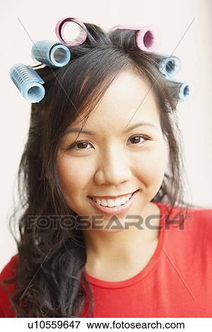 Portrait of a young woman smiling View Large Photo Image Stock Photo - Portrait of a young woman smiling. Fotosearch