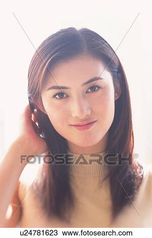 Closed Up Image of a Mid Adult Woman Touching her Head, Looking at Camera, Smiling, Front View View Large Photo Image Stock Image - Closed Up Image of a Mid Adult Woman Touching her Head, Looking at Camera, Smiling, Front View. Fotosearch