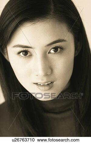 Closed Up Image of a Mid Adult Woman, Looking at Camera, Smiling, Front View View Large Photo Image Stock Image - Closed Up Image of a Mid Adult Woman, Looking at Camera, Smiling, Front View. Fotosearch