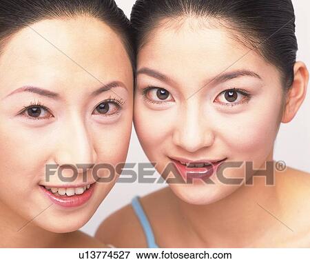 Closed Up Image of Two Rouged Mid Adult Women, Looking at Camera, Smiling View Large Photo Image Stock Photo - Closed Up Image of Two Rouged Mid Adult Women, Looking at Camera, Smiling. Fotosearch