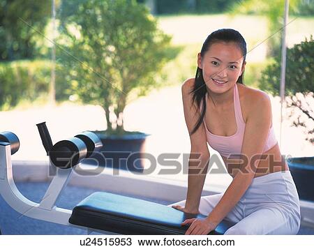 Image of a Young Adult Woman About to do Some Exercises, Looking at Camera, Smiling, Differential Focus View Large Photo Image Stock Image - Image of a Young Adult Woman About to do Some Exercises, Looking at Camera, Smiling, Differential Focus. Fotosearch