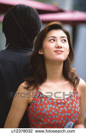 Image of a Young Adult Woman in a Red Dress, Smiling and Looking Sideways, Front View, Rear View View Large Photo Image Stock Image - Image of a Young Adult Woman in a Red Dress, Smiling and Looking Sideways, Front View, Rear View. Fotosearch