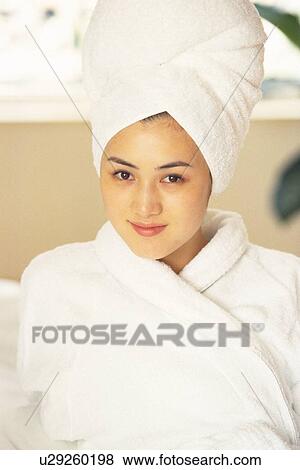 Image of a Young Adult Woman in a Bathrobe, her Hair Rolled in a White Towel, Smiling, Looking at Camera, High Angle View View Large Photo Image Stock Photo - Image of a Young Adult Woman in a Bathrobe, her Hair Rolled in a White Towel, Smiling, Looking at Camera, High Angle View. Fotosearch