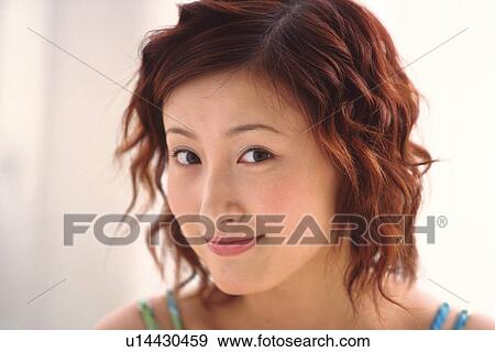 Stock Photo - Japanese woman smiling to camera. Fotosearch