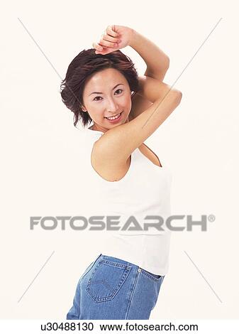 Woman smiling and lifting her arms up over shoulders View Large Photo Image Stock Image - Woman smiling and lifting her arms up over shoulders. Fotosearch