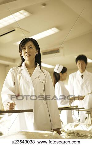 Stock Photo - Doctor and nurse. Fotosearch