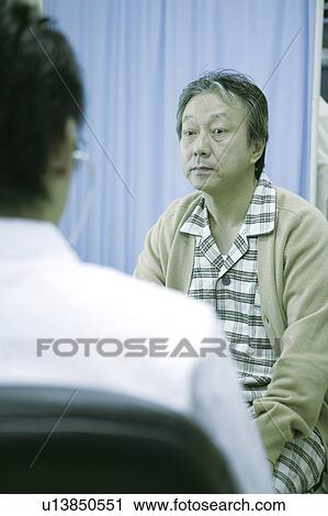 Stock Image - Doctor and patient. Fotosearch