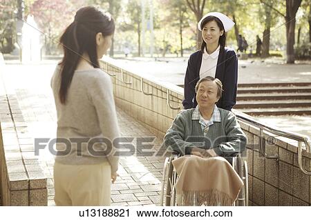 Stock Image - Nurse and patient. Fotosearch