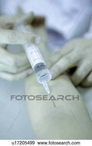 Nurse taking blood from patient View Large Photo Image Stock Photo - Nurse taking blood from patient. Fotosearch