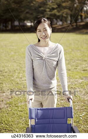 Woman and wheelchair, portrait View Large Photo Image Stock Image - Woman and wheelchair, portrait . Fotosearch