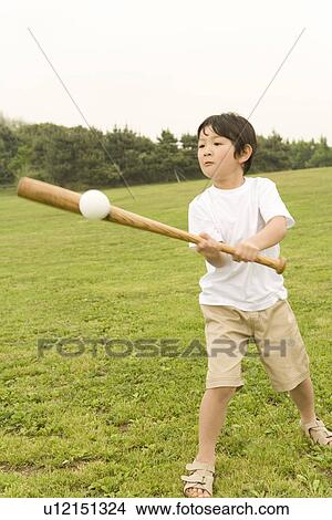 Photography of a boy playing baseball, High Angle View View Large Photo Image Picture - Photography of a boy playing baseball, High Angle View. Fotosearch