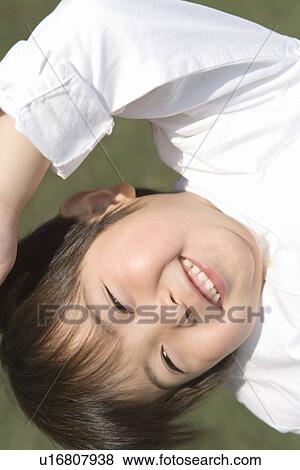 Photography of a boy smiling at camera, Close Up View Large Photo Image Stock Photo - Photography of a boy smiling at camera, Close Up. Fotosearch