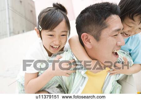 Photography of a father and children playing, Low Angle View View Large Photo Image Stock Image - Photography of a father and children playing, Low Angle View. Fotosearch