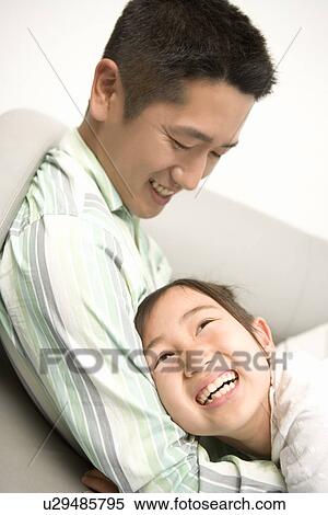 Photography of a father and daughter playing, High Angle View View Large Photo Image Stock Photography - Photography of a father and daughter playing, High Angle View. Fotosearch