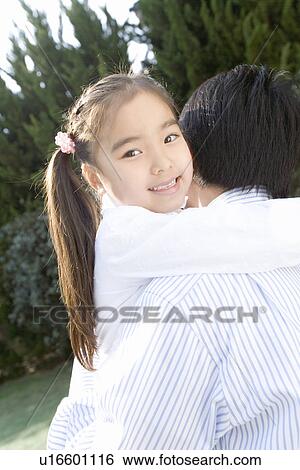 Photography of a father lifting daughter, High Angle View View Large Photo Image Stock Photograph - Photography of a father lifting daughter, High Angle View. Fotosearch