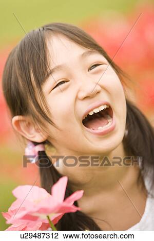 Photography of a girl in the flower garden, High Angle View View Large Photo Image Stock Image - Photography of a girl in the flower garden, High Angle View. Fotosearch