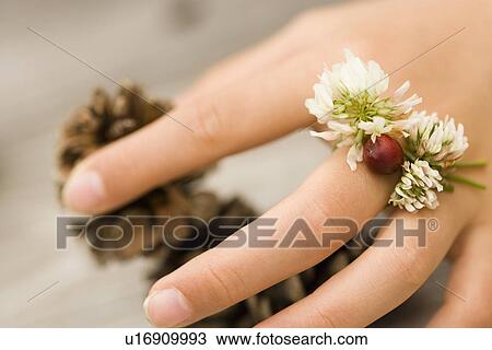 Photography of a hand with accessories made of flowers, Close Up, Differential Focus View Large Photo Image Stock Image - Photography of a hand with accessories made of flowers, Close Up, Differential Focus. Fotosearch