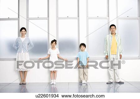 Picture - Photography of parents and children standing by the windows, Front View. Fotosearch
