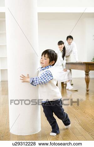 Photography of parents watching son playing, Low Angle View View Large Photo Image Stock Photo - Photography of parents watching son playing, Low Angle View. Fotosearch