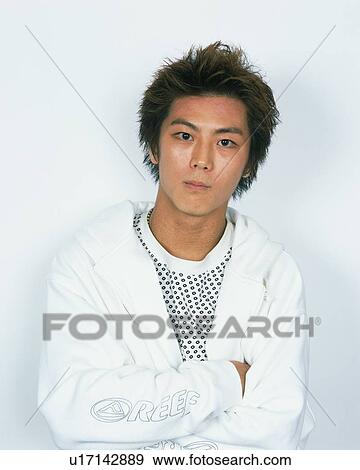 Portrait of Young Man Folding Arms, Front View View Large Photo Image Stock Photo - Portrait of Young Man Folding Arms, Front View. Fotosearch