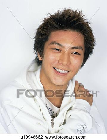 Stock Image - Portrait of Young Man Smiling, Front View . Fotosearch