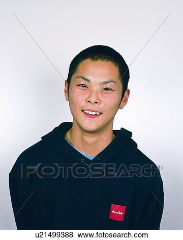 Stock Photo - Portrait of Young Man Smiling, Front View . Fotosearch